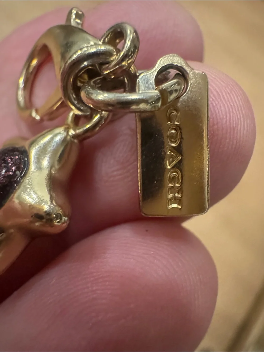 Coach Gold-Tone Shooting Star Key Charm with Purple Accents